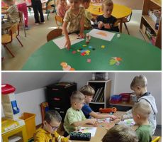 na zdjęciu widać salę przedszkolną, dzieci siedzą przy stolikach, tworzą dinozaura z figur geometrycznych